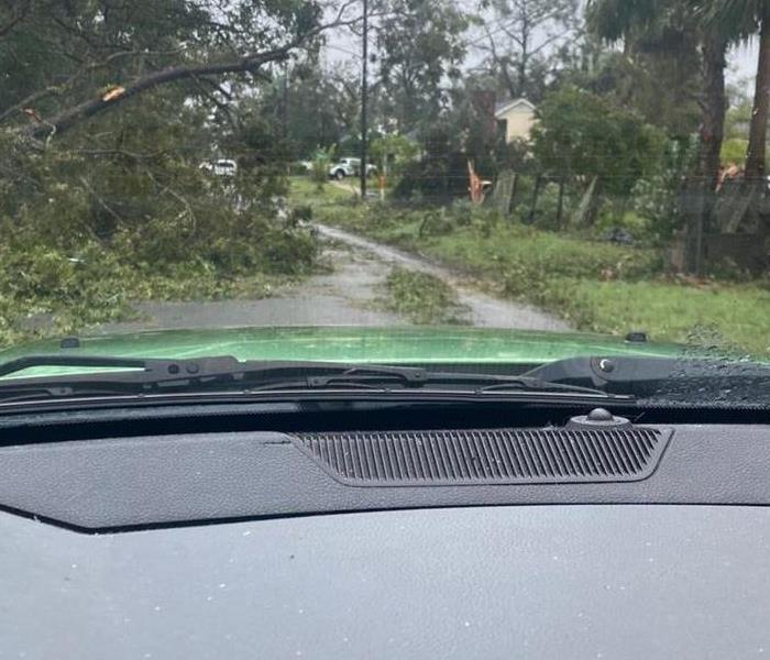 Service vehicle driving after hurricane passed through